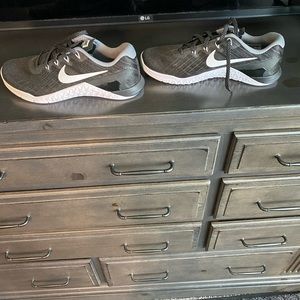 Black silver gray Nike trainers
